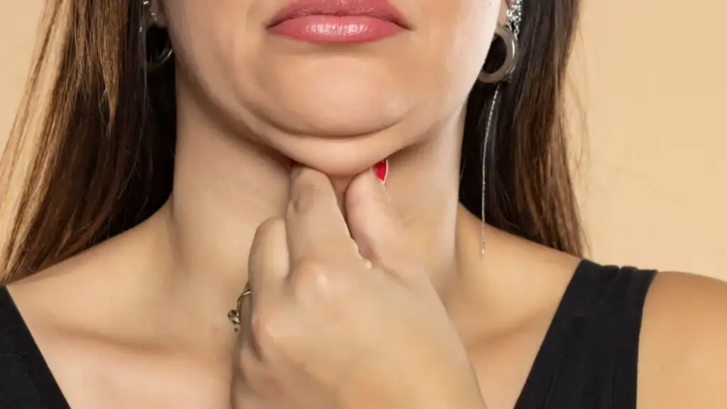 An image of a woman with double chin, sad, worried : Non Surgical Double Chin Removal Treatment in Wakefield, UK